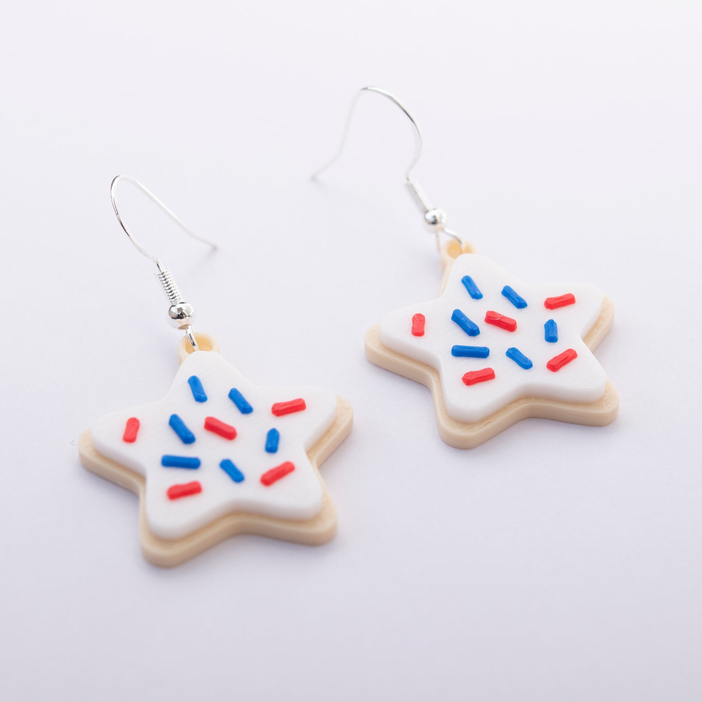 Red, white, and blue star-shaped sugar cookie earrings – 4th of July jewelry by Orla & Co